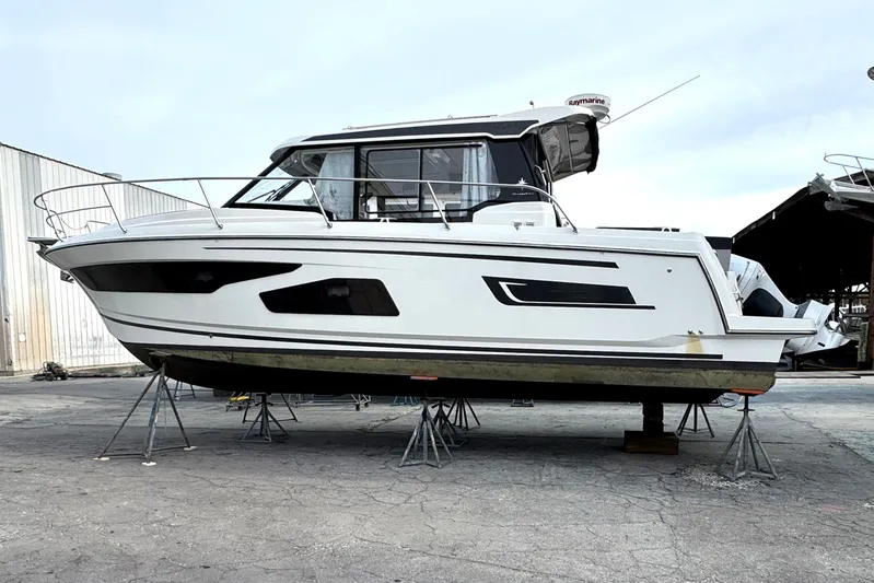Bohemian Yacht Photos Pics 2021 Jeanneau NC Weekender 1095 boat on stands in a marina.
