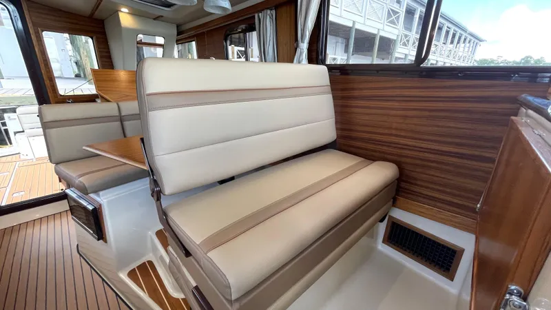  Yacht Photos Pics Interior of 2023 Ranger Tugs R-31 CB with beige seating and wood accents.