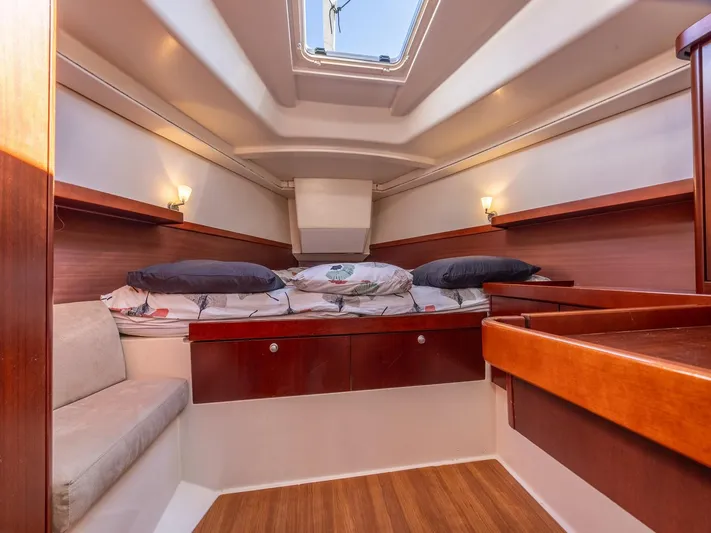  Yacht Photos Pics 2008 Hanse 400 yacht cabin with cozy bedding and wooden interior.