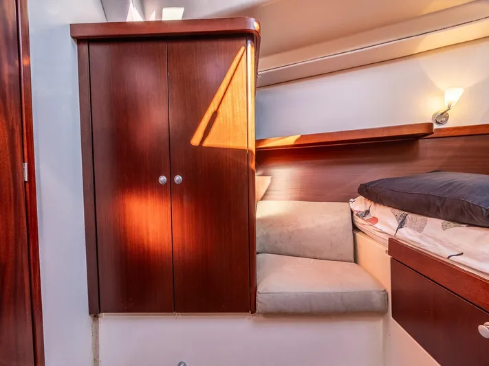  Yacht Photos Pics Interior of 2008 Hanse 400 yacht with wooden cabinet and cozy seating area.