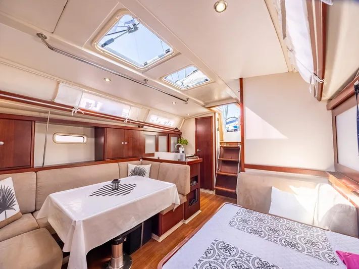  Yacht Photos Pics Interior of 2008 Hanse 400 yacht, featuring elegant dining and seating area with natural light.