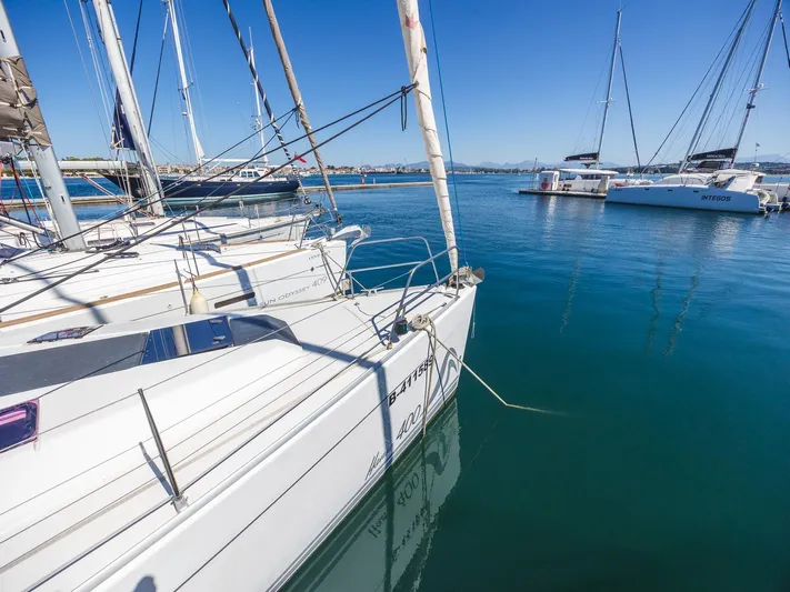  Yacht Photos Pics Sailboats docked in a marina, featuring a 2008 Hanse 400 under clear blue skies.