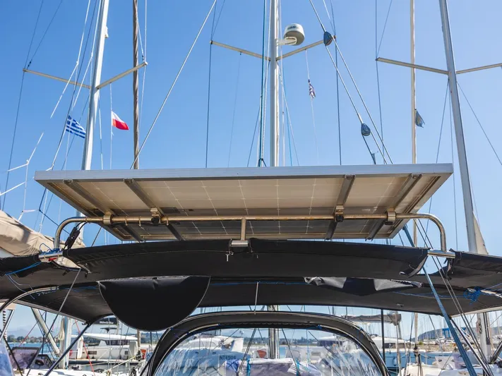  Yacht Photos Pics Sailboat with solar panel, Hanse 400, 2008 model, docked in marina under clear blue sky.