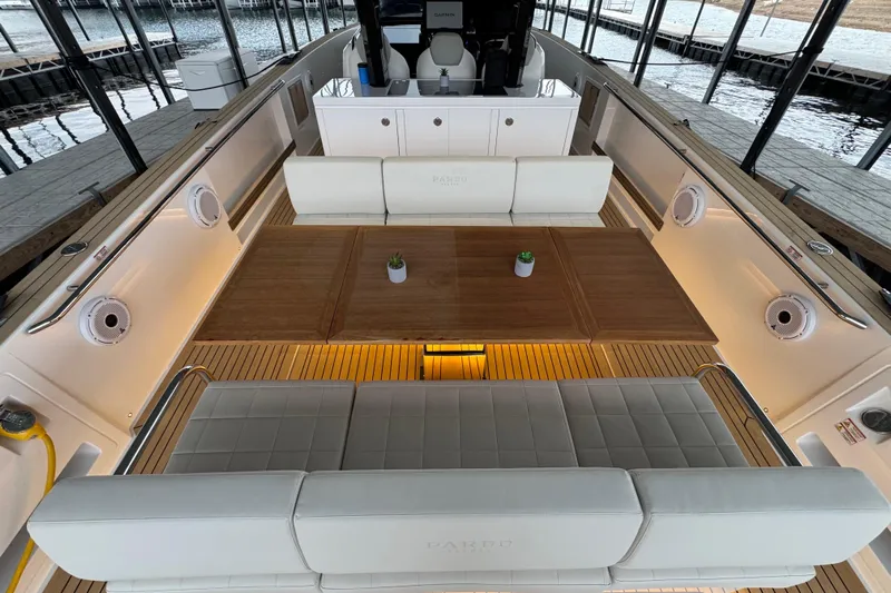 Yacht Photos Pics Luxurious 2025 Pardo Yachts P38 interior with elegant seating and wooden table.