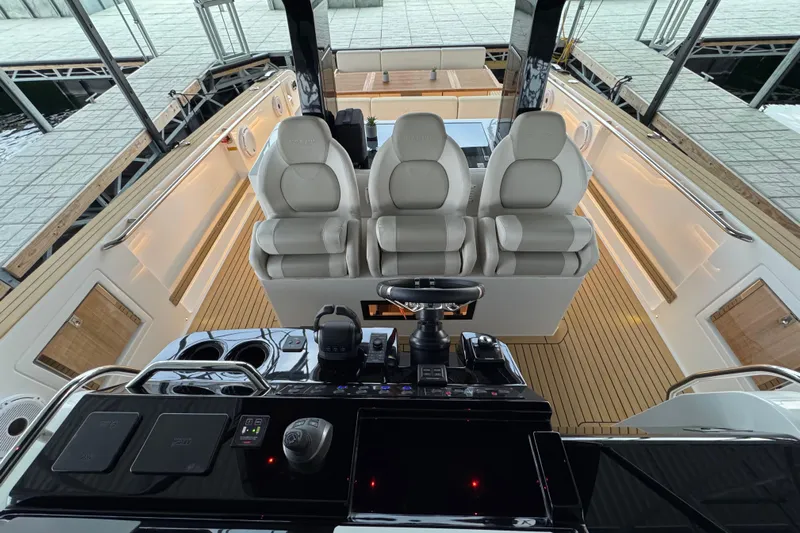  Yacht Photos Pics Interior view of 2025 Pardo Yachts P38, featuring luxurious seating and modern controls.