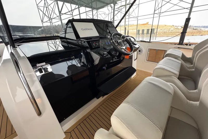  Yacht Photos Pics Helm of 2025 Pardo Yachts P38 with Garmin navigation, luxury seating, and modern controls.