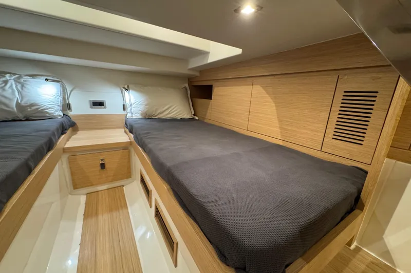  Yacht Photos Pics Luxurious cabin interior of 2025 Pardo Yachts P38 with twin beds and modern wood finish.