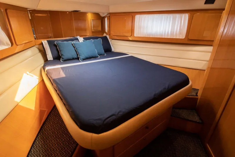  Yacht Photos Pics Luxurious cabin interior of 1996 Uniesse 48 Open yacht with elegant bedding.