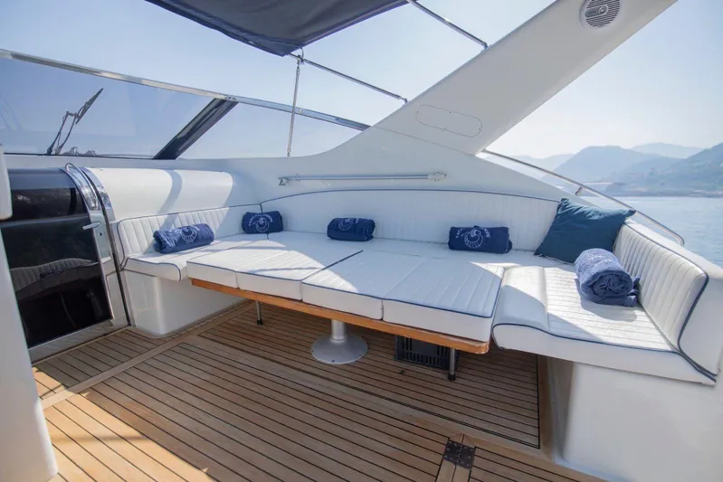  Yacht Photos Pics Luxurious seating area on 1996 Uniesse 48 Open yacht with scenic views.