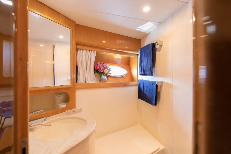  Yacht Photos Pics Luxurious bathroom in 1996 Uniesse 48 Open yacht with elegant decor and natural lighting.