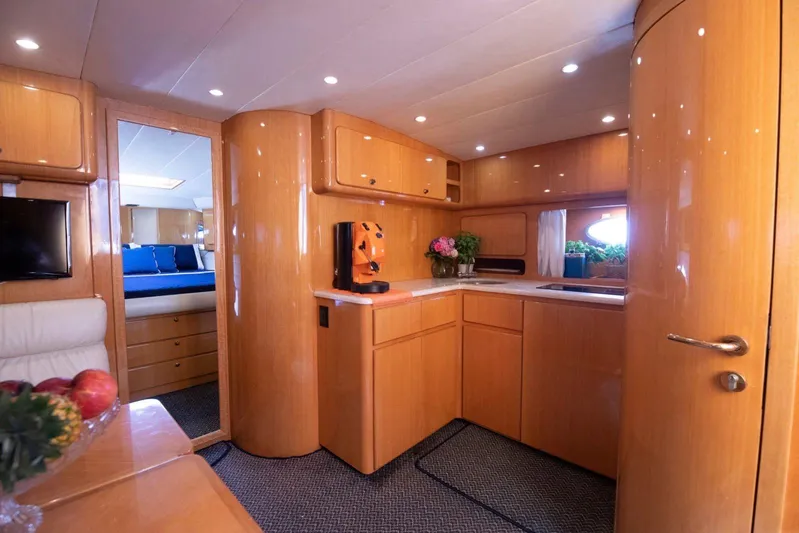  Yacht Photos Pics Luxurious interior of 1996 Uniesse 48 Open yacht with modern kitchen and cozy seating.