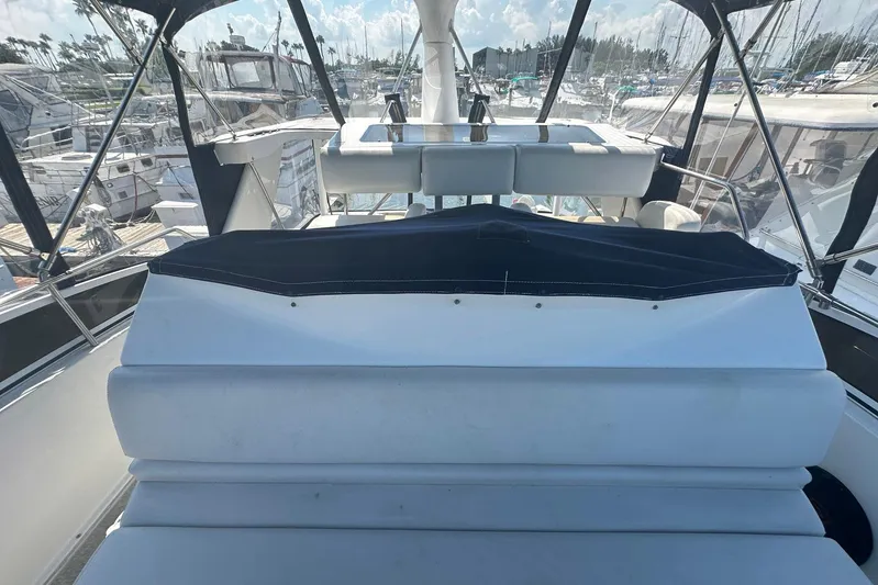 Dunac's Minni Conn III Yacht Photos Pics 1997 Silverton 422 Motor Yacht interior with seating, docked at marina.