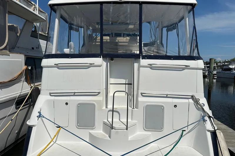 Dunac's Minni Conn III Yacht Photos Pics 1997 Silverton 422 Motor Yacht docked at marina, rear view.