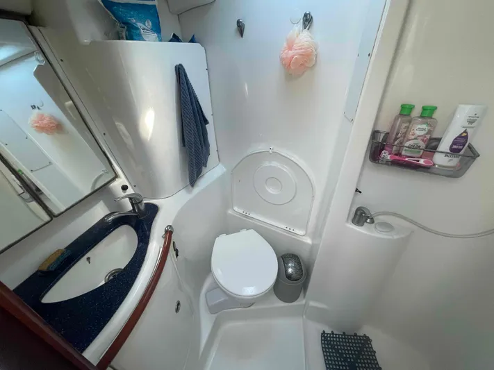 Tiramisu Yacht Photos Pics 2004 Beneteau Oceanis 473 bathroom with sink, toilet, and toiletries.