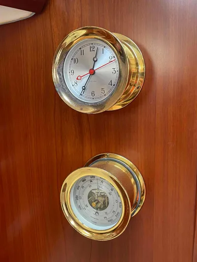 Tiramisu Yacht Photos Pics Brass clock and barometer on Beneteau Oceanis 473 yacht, 2004 model.