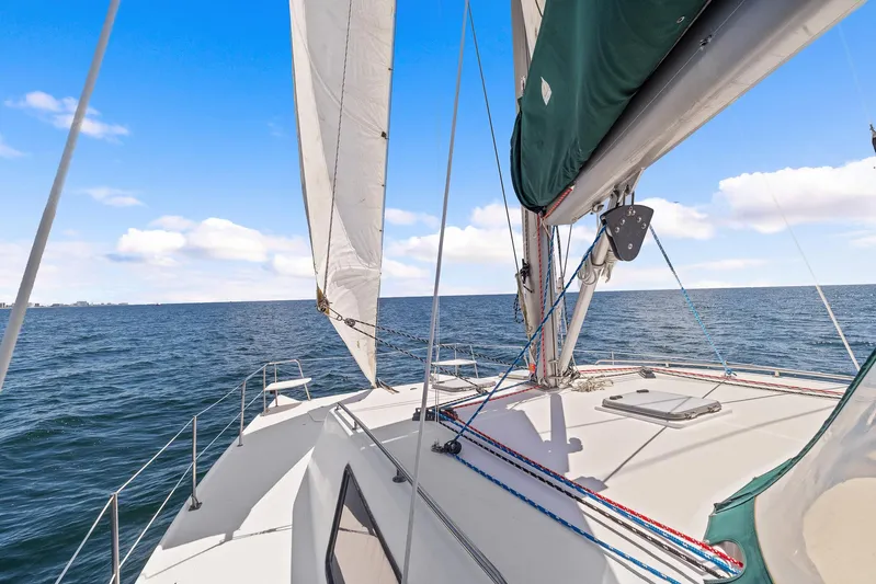 Shamrock Yacht Photos Pics 2002 Endeavour 44 Sail Catamaran sailing on open water under a clear blue sky.