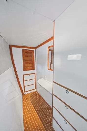 Shamrock Yacht Photos Pics Interior of 2002 Endeavour 44 Sail Catamaran with wooden flooring and white cabinetry.