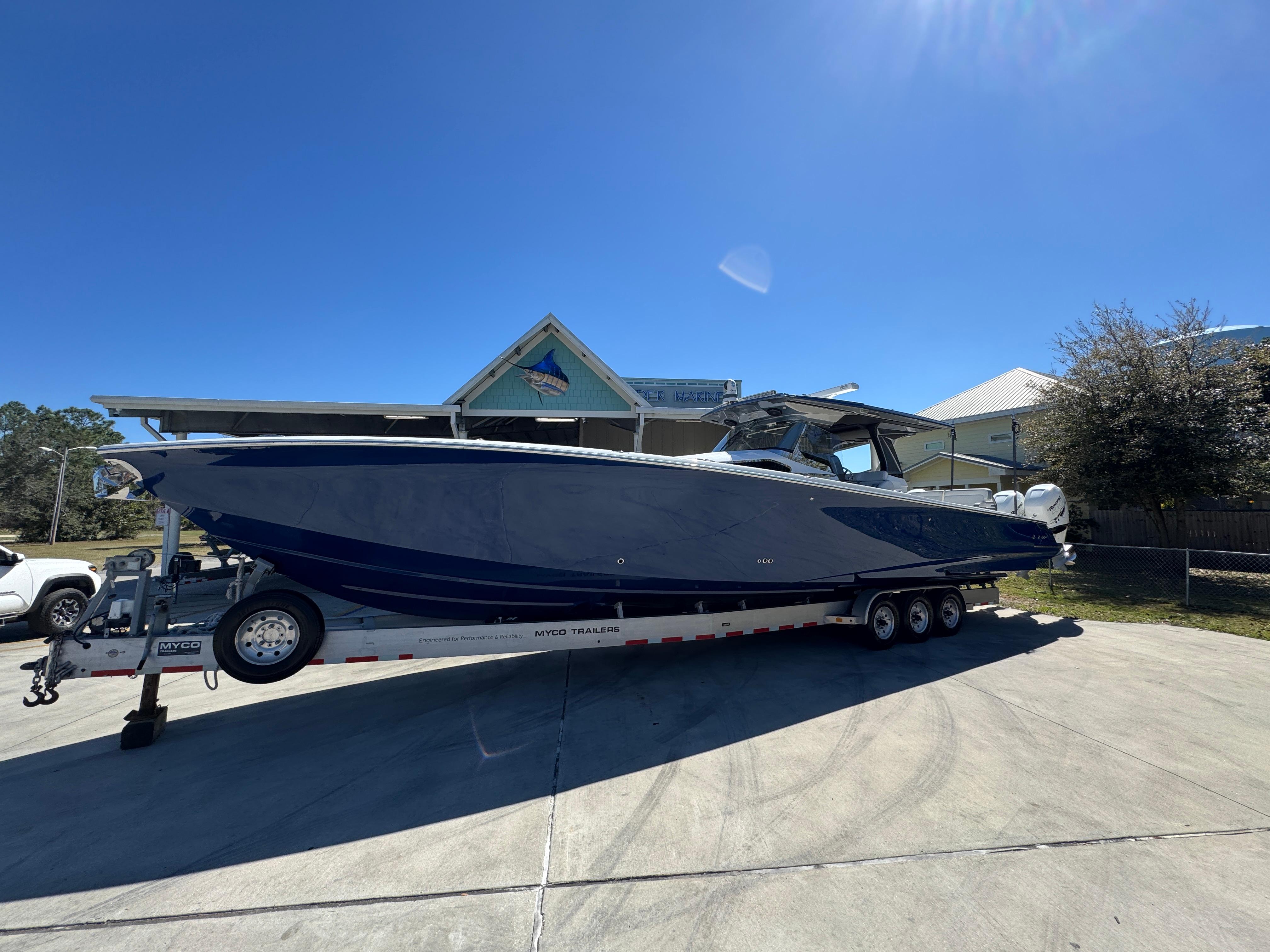 2018 Nor-Tech 452 Super Fish boat on trailer, parked outdoors under clear blue sky.