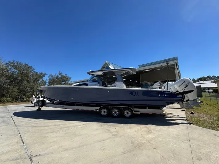  Yacht Photos Pics 2018 Nor-Tech 452 Super Fish boat on trailer, parked outdoors under clear blue sky.