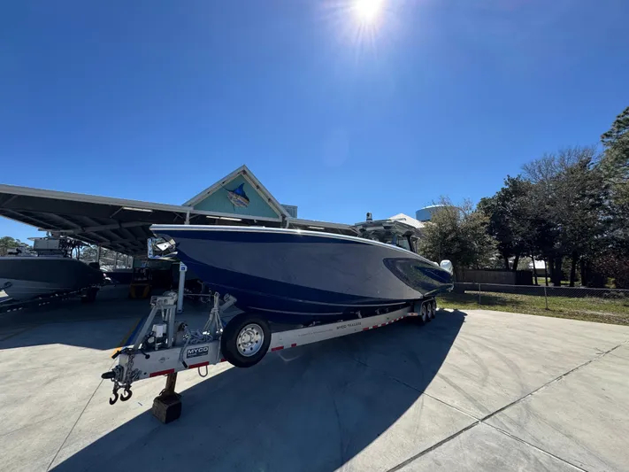  Yacht Photos Pics 2018 Nor-Tech 452 Super Fish boat on trailer under clear blue sky.