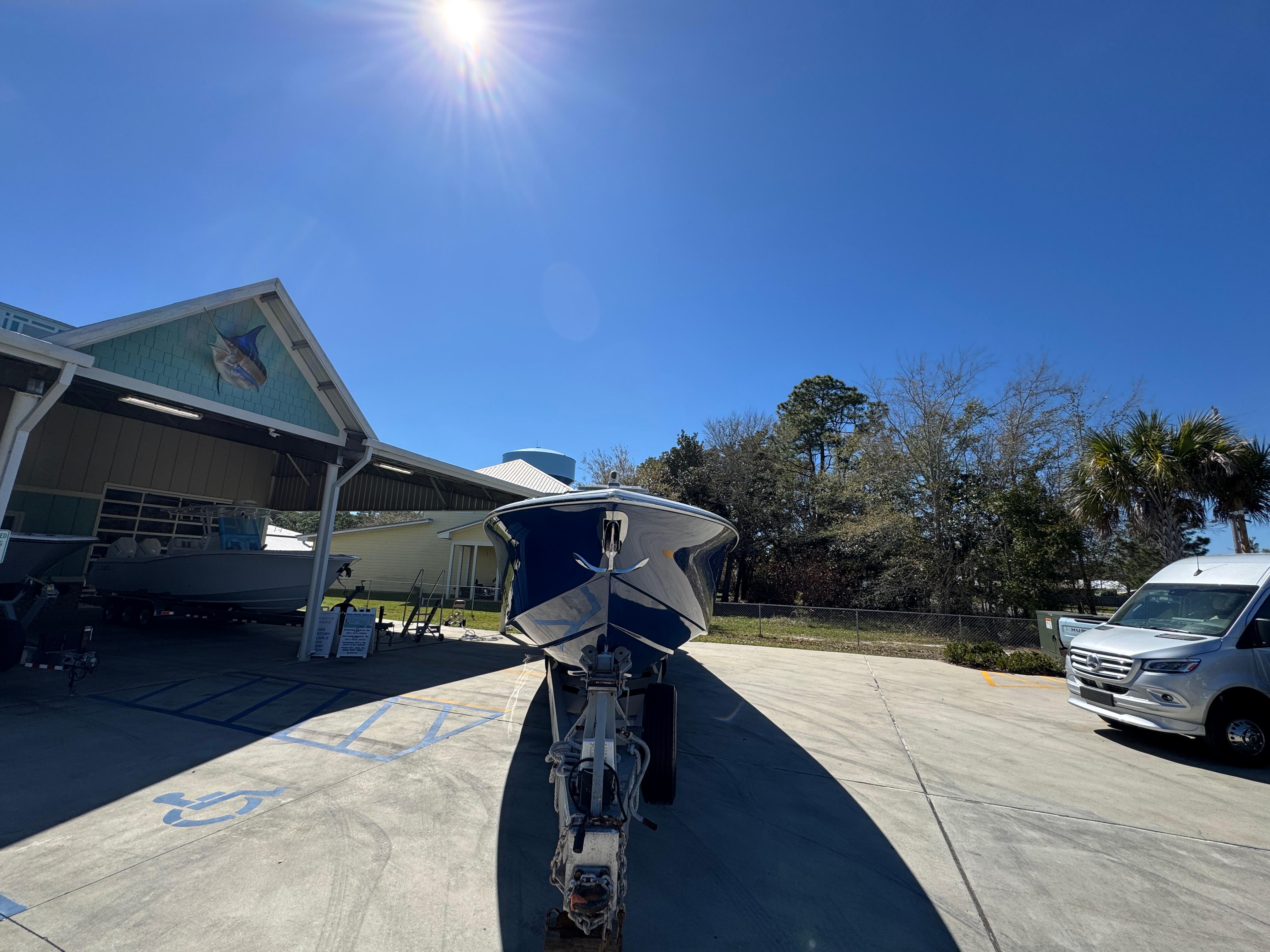 2018 Nor-Tech 452 Super Fish boat parked outdoors under clear blue sky.
