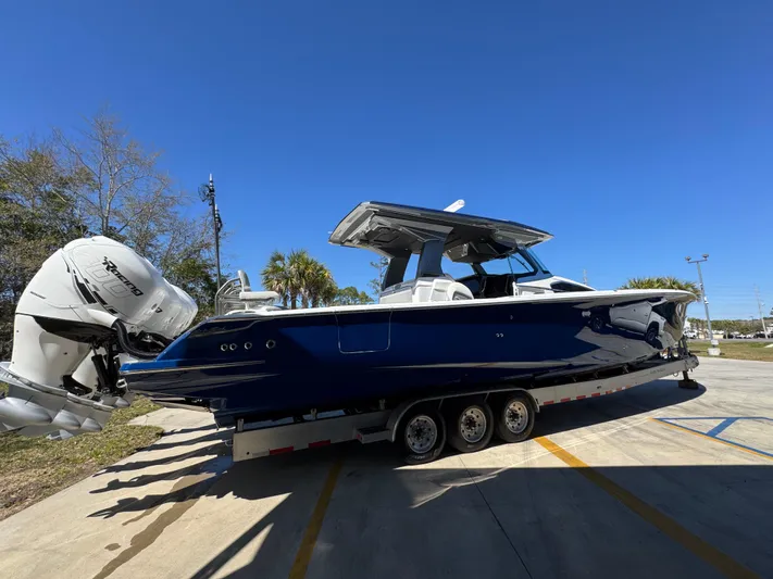  Yacht Photos Pics 2018 Nor-Tech 452 Super Fish boat on trailer, blue hull, triple outboard engines.