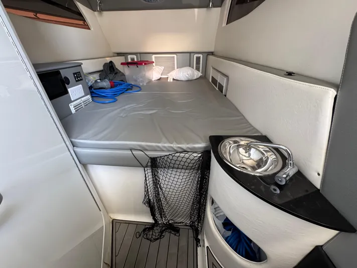  Yacht Photos Pics 2018 Nor-Tech 452 Super Fish cabin interior with bed, sink, and storage.