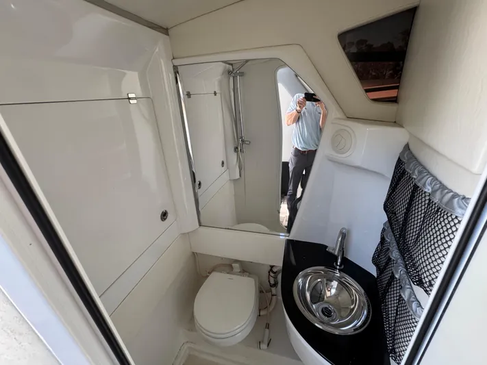  Yacht Photos Pics 2018 Nor-Tech 452 Super Fish boat bathroom with sink and toilet.