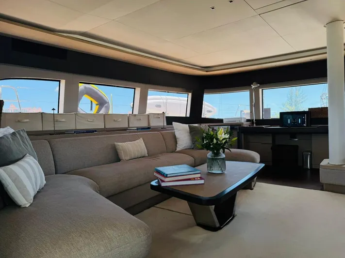  Yacht Photos Pics Luxurious interior of 2024 Lagoon 65 yacht with modern furnishings and panoramic windows.