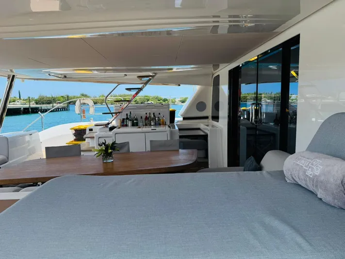  Yacht Photos Pics Luxurious 2024 Lagoon 65 yacht interior with dining area and ocean view.