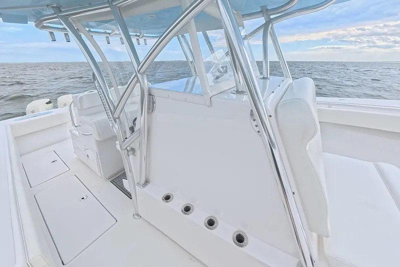  Yacht Photos Pics 2019 SeaHunter 33 Tournament boat interior with sleek white seating and ocean backdrop.