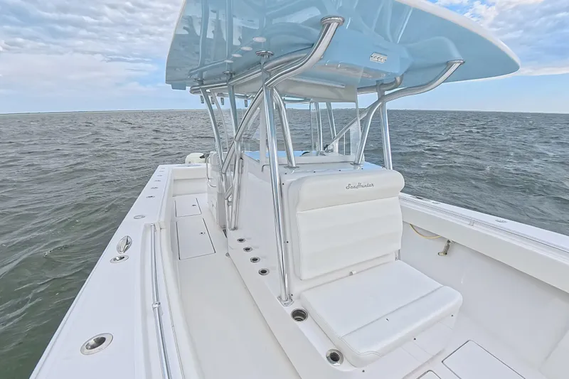  Yacht Photos Pics 2019 SeaHunter 33 Tournament boat on open water, featuring sleek design and spacious deck.