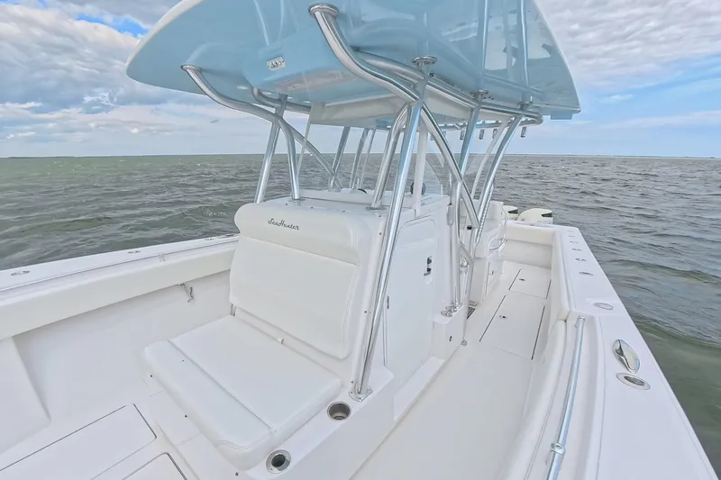  Yacht Photos Pics 2019 SeaHunter 33 Tournament boat on open water, featuring sleek design and spacious deck.