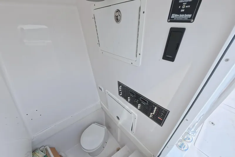  Yacht Photos Pics Interior of 2019 SeaHunter 33 Tournament boat featuring a compact marine toilet.