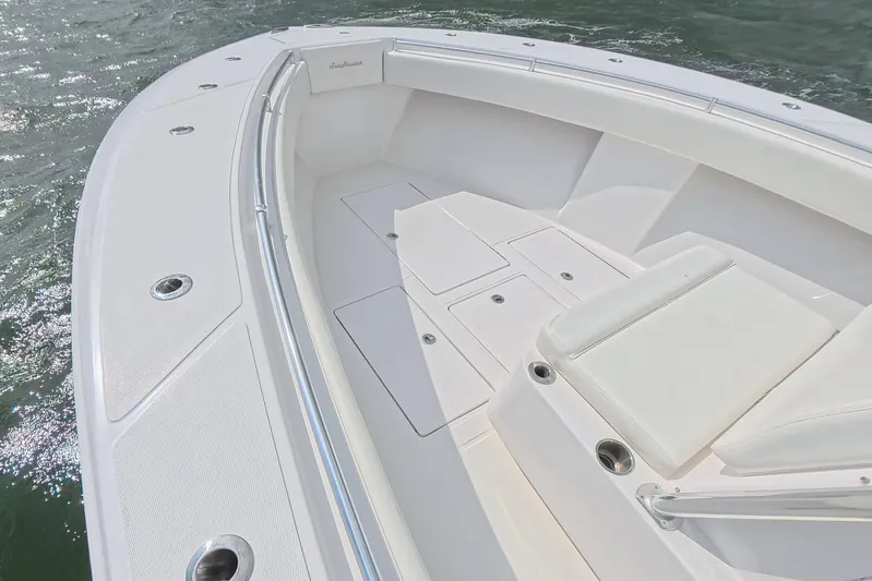  Yacht Photos Pics 2019 SeaHunter 33 Tournament boat deck with white seating and storage compartments.