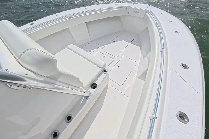 Yacht Photos Pics 2019 SeaHunter 33 Tournament boat, white interior, spacious seating, sleek design, ocean backdrop.