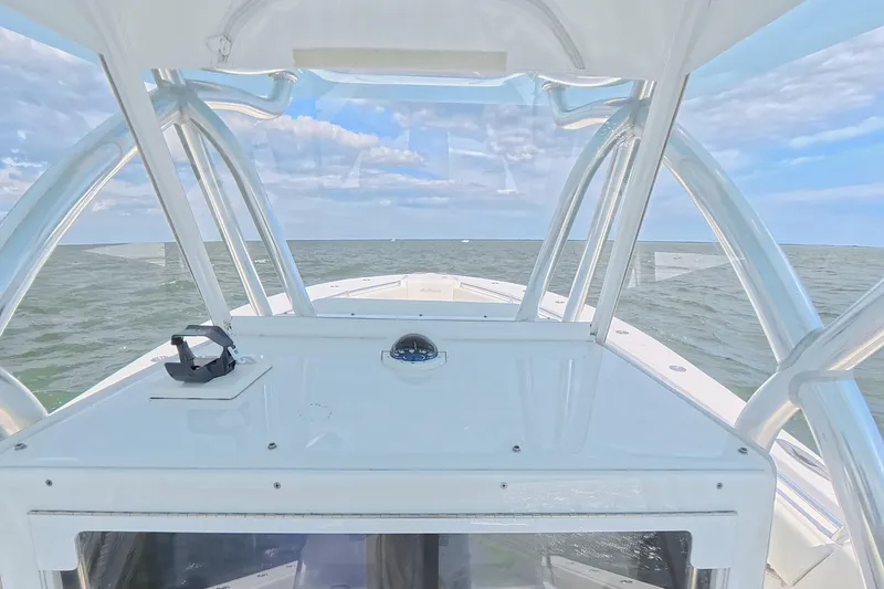  Yacht Photos Pics 2019 SeaHunter 33 Tournament boat dashboard view on open water under blue sky.