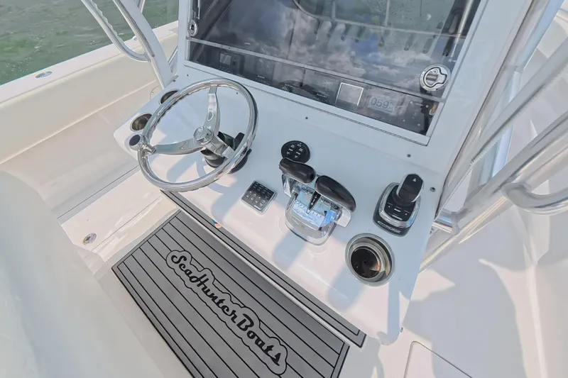  Yacht Photos Pics 2019 SeaHunter 33 Tournament boat helm with steering wheel and controls.