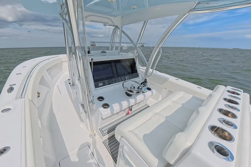  Yacht Photos Pics 2019 SeaHunter 33 Tournament boat interior with helm, ocean view, and clear sky.
