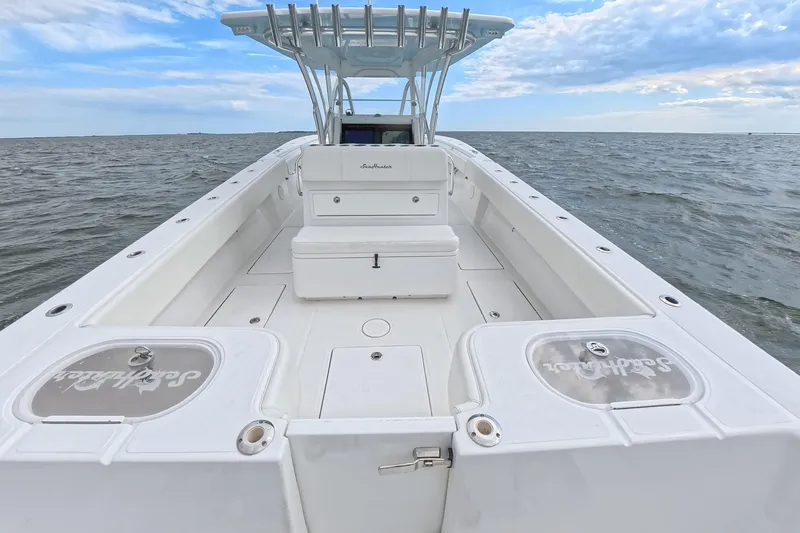  Yacht Photos Pics 2019 SeaHunter 33 Tournament boat on open water, showcasing spacious deck and seating.