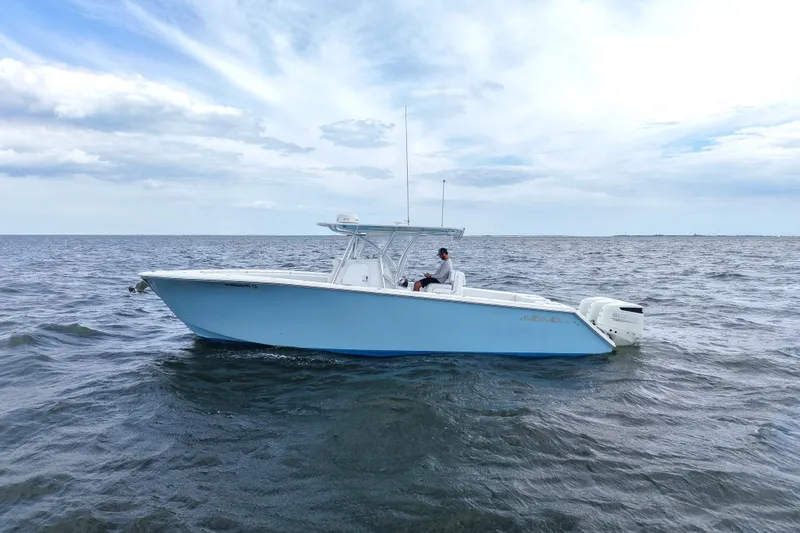  Yacht Photos Pics 2019 SeaHunter 33 Tournament boat on open water under a cloudy sky.
