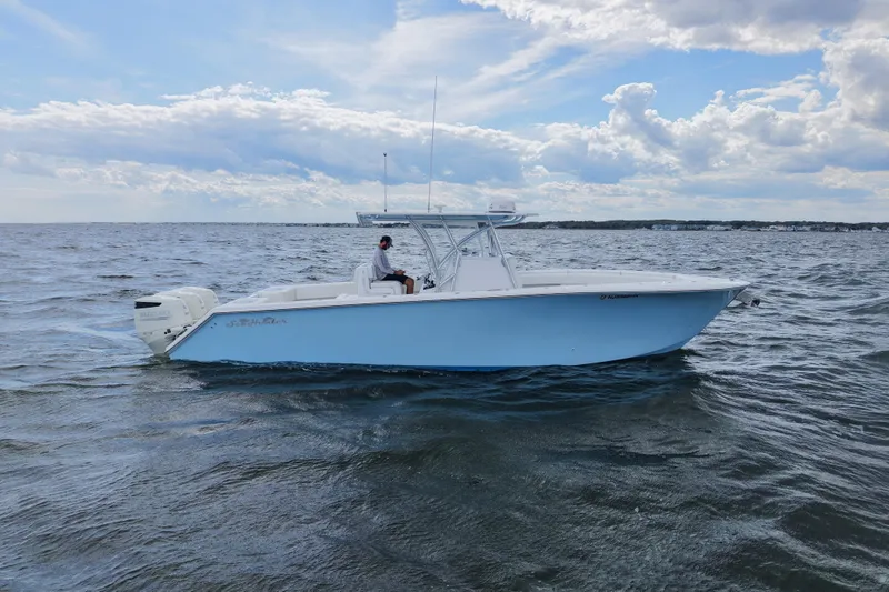  Yacht Photos Pics 2019 SeaHunter 33 Tournament boat on open water under a partly cloudy sky.