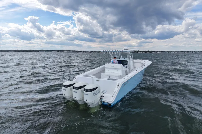  Yacht Photos Pics 2019 SeaHunter 33 Tournament boat with triple Suzuki engines on open water.