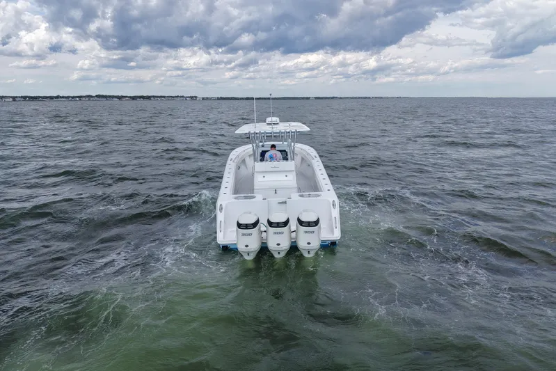 Yacht Photos Pics 2019 SeaHunter 33 Tournament boat cruising on open water under cloudy skies.
