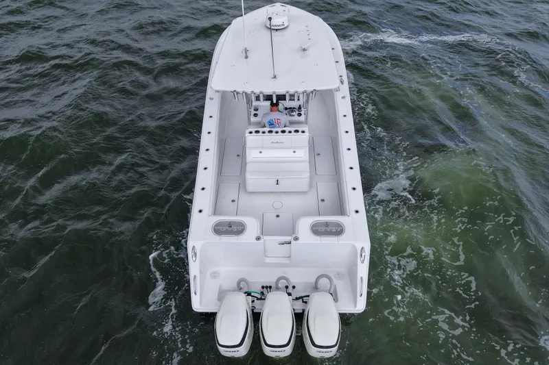  Yacht Photos Pics 2019 SeaHunter 33 Tournament boat on water, aerial view, triple engines visible.