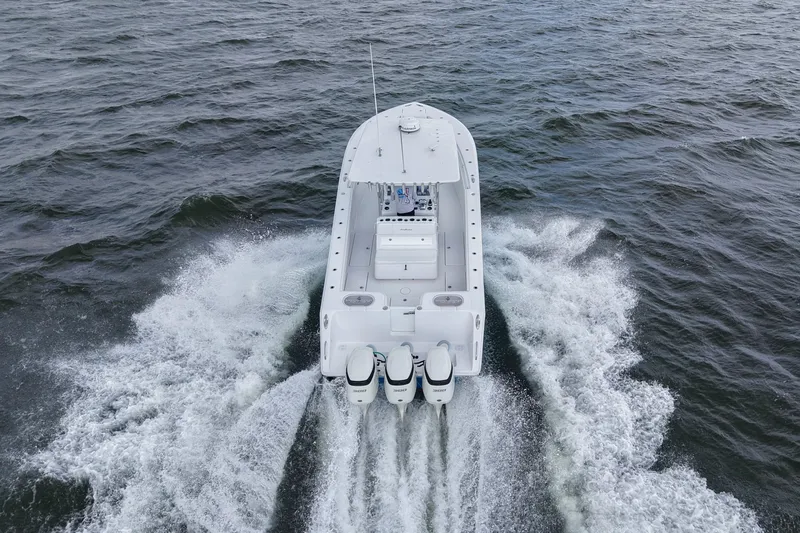  Yacht Photos Pics 2019 SeaHunter 33 Tournament boat cruising on open water, aerial view.