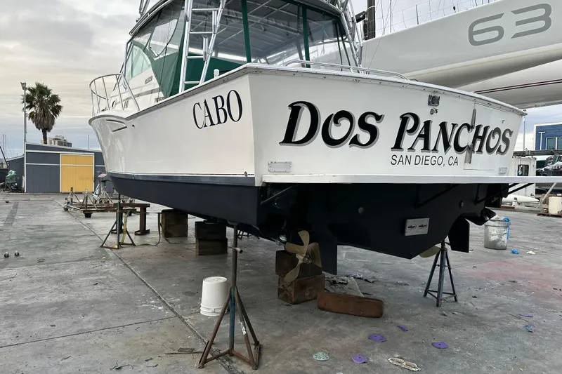 Dos Panchos Yacht Photos Pics 1997 Cabo 35 Express boat named "Dos Panchos" in San Diego, CA, on dry dock.