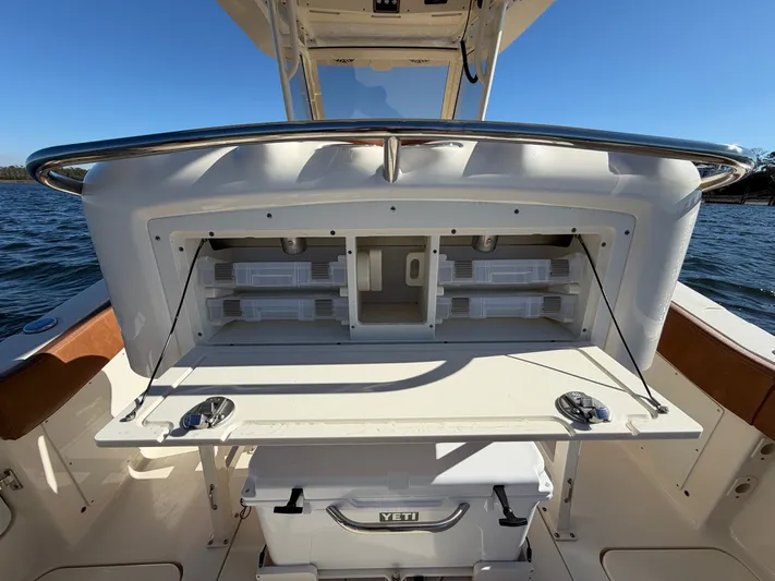  Yacht Photos Pics Scout 277 LXF 2026 with open storage and Yeti cooler.