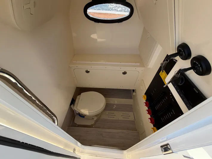  Yacht Photos Pics Interior of 2026 Scout 277 LXF featuring toilet and controls.