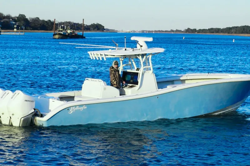  Yacht Photos Pics 2007 Yellowfin 36 Offshore boat on blue water, featuring triple Mercury engines.